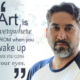 Artist Alejandro with salt and pepper beard close cropped hair and a blue and white baseball shirt. His quote reads "Art is everywhere from when you wake up until you close your eyes."