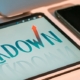 Small tablet beside cell phone. On the tablet it reads lockdown in all capital letters