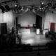 black and white image of an empty theatre stage