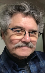 head shot of Steven Ross Smith - man with glasses and mustache and salt and pepper hair.