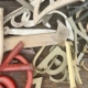jumbled up letters in a pile from red to brass