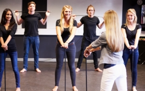 Adult dance class. Everyone holding canes.