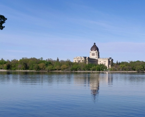 Sask Legislative building with Wascana Lake in the foreground.