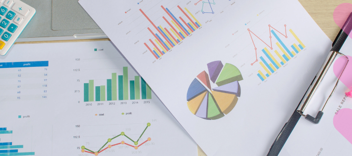graphs on paper on a desk