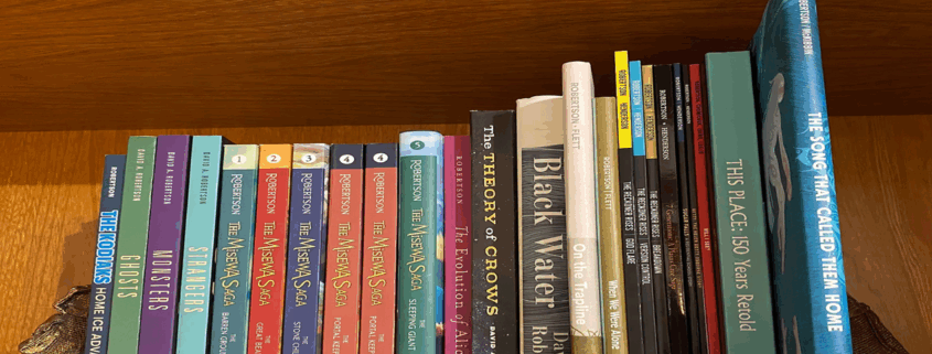 colour photo of books on a shelf, all by Canadian author David Robertson