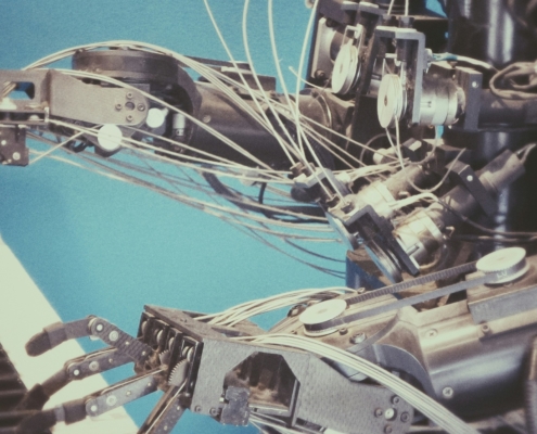 Metal robot playing a keyboard