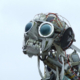 Sculpture of a robotic with human teeth and large black glass eyes