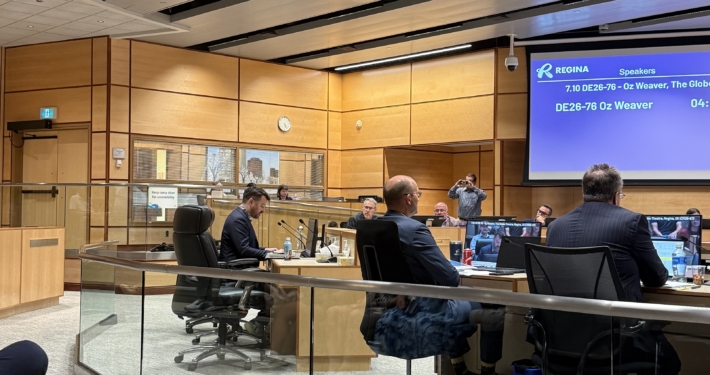 A view of Regina City Council Chambers from the gallery, looking towards council and Oz Weaver, Globe Theatre CEO, presenting at Regina City Council.