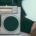 A person laying back with their foot on a Vintage metal stereo. The sole of the other foot is relaxed next to it.
