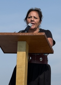 Saulteaux artist Dr. Mary Longman speaks at the dedication of Passage Home, a new bronze monument and healing garden in Prince Albert, 2026.