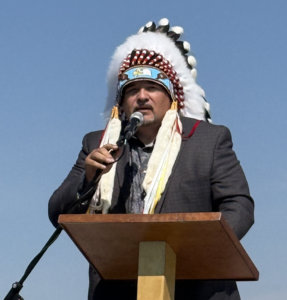Chief Longman speaks at the dedication of artwork Passage Home in Prince Albert, 2026.