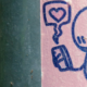 Doodle of person looking at their cellphone with a bubble with a heart at its centre coming from it. The doodle is in blue pen on pink paper.